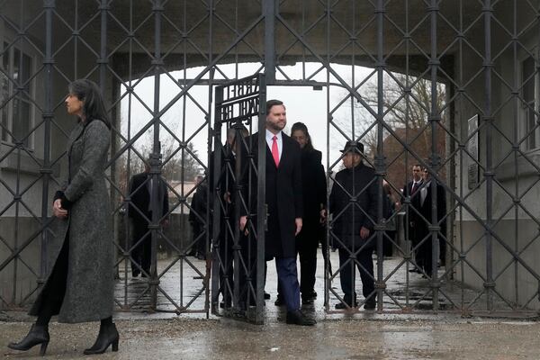 U.S. Vice President JD Vance and second lady Usha Vance enter the Dachau Concentration Camp Memorial Site outside Munich, Germany, Thursday, Feb. 13, 2025. (AP Photo/Matthias Schrader)