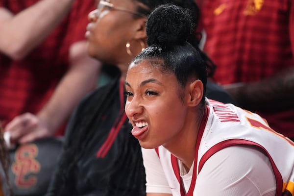 Southern California guard JuJu Watkins takes a breather after being taken out of the game in the final seconds of the second half of an NCAA college basketball game against Michigan, Sunday, Dec. 29, 2024, in Los Angeles. (AP Photo/Mark J. Terrill)