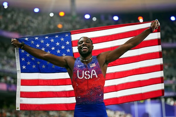 FILE - Noah Lyles, of the United States, celebrates after winning the men's 100-meter final at the 2024 Summer Olympics, Sunday, Aug. 4, 2024, in Saint-Denis, France. (AP Photo/Petr David Josek, File)