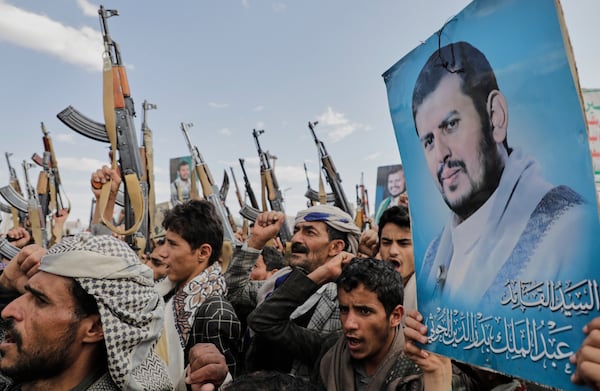 Houthi supporters chant slogans and hold pictures of Abdul Malik al-Houthi, the leader of the Houthi movement, during an anti-U.S. and anti-Israel rally in Sanaa, Yemen, Monday, March 17, 2025. (AP Photo/Osamah Abdulrahman)