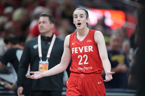 Indiana Fever guard Caitlin Clark (22) reacts after being called for a flagrant foul on Chicago Sky forward Angel Reese during the second half an WNBA basketball game in Indianapolis, Saturday, May 17, 2025. (AP Photo/AJ Mast)