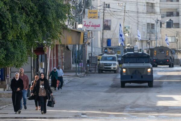 Israeli army vehicles are seen during a military operation in the West Bank city of Jenin, Tuesday, Jan. 21, 2025. (AP Photo/Majdi Mohammed).