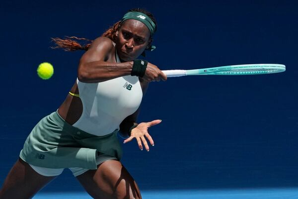 Coco Gauff of the U.S. returns a shot from Belinda Bencic of Switzerland during their fourth round match at the Australian Open tennis championship in Melbourne, Australia, Sunday, Jan. 19, 2025. (AP Photo/Mark Baker)