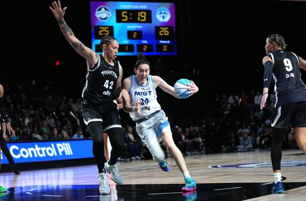 Phantom center Brittney Griner (42) defends against Mist forward Breanna Stewart (30) during the first half of an Unrivaled 3-on-3 basketball game Friday, Jan. 24, 2025, in Medley, Fla. (AP Photo/Lynne Sladky)