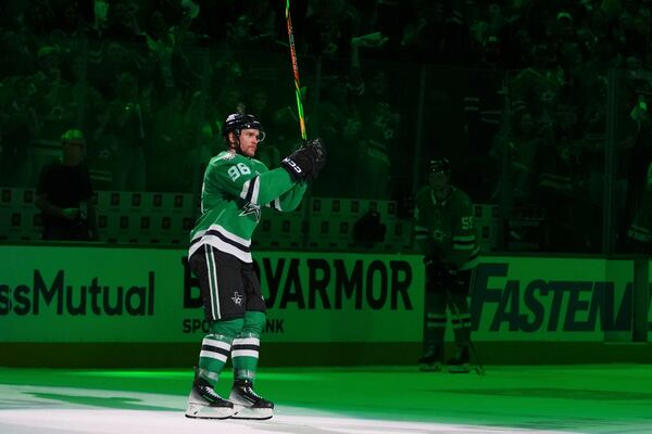 Dallas Stars right wing Mikko Rantanen acknowleges cheers from fans after Game 3 of a second-round NHL hockey playoff series against the Winnipeg Jets in Dallas, Sunday, May 11, 2025. (AP Photo/Julio Cortez)