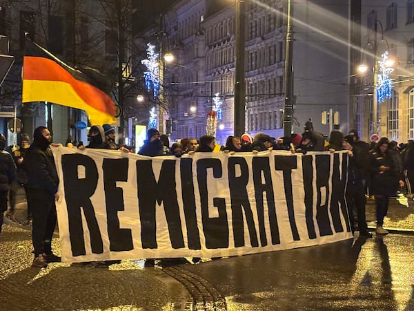 "Remigration" is written on a banner at a demonstration by right-wing groups in Magdeburg, Germany, Saturday, Dec. 21, 2024. (dpa via AP)