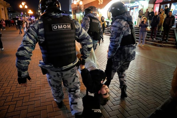 FILE - Riot police detain a demonstrator during a protest of the mobilization of reservists for fighting in Ukraine, in Moscow, Sept. 21, 2022. (AP Photo, File)