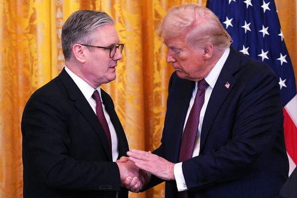 FILE - Britain's Prime Minister Keir Starmer, left, and U.S. President Donald Trump shake hands at a joint press conference in the East Room at the White House Thursday, Feb. 27, 2025, in Washington. (Carl Court/Pool Photo via AP, File)
