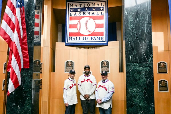 Newly-elected Baseball Hall of Fame members, from left, Ichiro Suzuki, CC Sabathia and Billy Wagner, pose for photo in the plaque room during a news conference Thursday, Jan. 23, 2025, in Cooperstown, N.Y. (AP Photo/Hans Pennink)