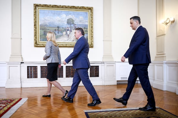 Members of the Bosnian Presidency Zeljka Cvijanovic, left, Zeljko Komsic, center, and Denis Becirovic walk to the photo op with the NATO Secretary General Mark Rutte, prior to the start of their meeting in Sarajevo, Bosnia, Monday, March 10, 2025. (AP Photo/Armin Durgut)