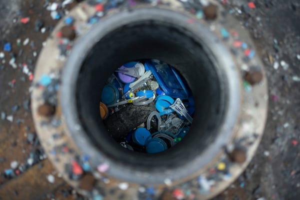 Different types of plastic are seen inside Petgaserita, a non-catalytic pyrolysis machine, which will be converted into fuel, in Boca del Rio, Veracruz, Mexico, Jan. 4, 2025. (AP Photo/Felix Marquez)