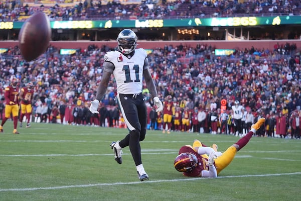 Washington Commanders cornerback Marshon Lattimore (23) is called for pass interference against Philadelphia Eagles wide receiver A.J. Brown (11) during the second half of an NFL football game, Sunday, Dec. 22, 2024, in Landover, Md. (AP Photo/Stephanie Scarbrough)