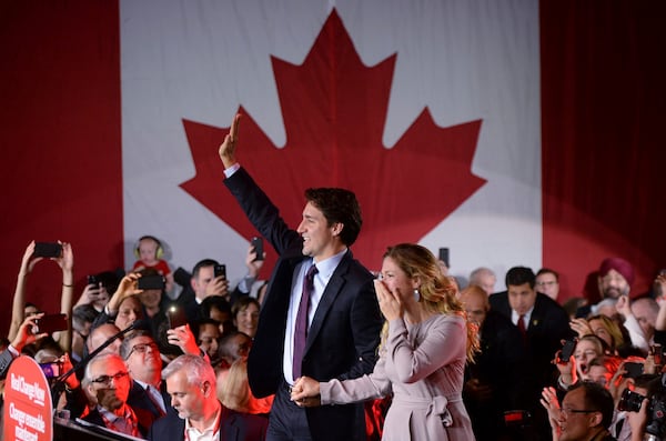 FILE - Liberal leader Justin Trudeau makes his way to the stage with wife Sophie Gregoire at the Liberal party headquarters in Montreal on Oct. 20, 2015. Trudeau, the son of late Prime Minister Pierre Trudeau, became Canada's new prime minister after beating Conservative Stephen Harper. (Sean Kilpatrick/The Canadian Press via AP, File)