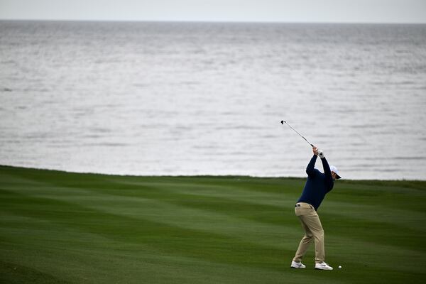 Scottie Scheffler hits from the sixth fairway at Pebble Beach Golf Links during the second round of the AT&T Pebble Beach Pro-Am golf tournament, Friday, Jan. 31, 2025, in Pebble Beach, Calif. (AP Photo/Nic Coury)