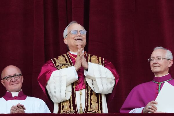 Newly elected Pope Leo XIV appears at the balcony of St. Peter's Basilica at the Vatican, Thursday, May 8, 2025. (AP Photo/Alessandra Tarantino)