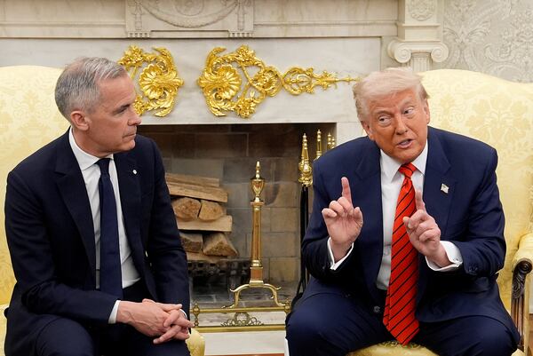 Prime Minister Mark Carney and U.S. President Donald Trump engage in a meeting at the White House in Washington, D.C., Tuesday, May 6, 2025. (Adrian Wyld /The Canadian Press via AP)