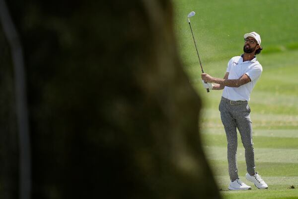 Akshay Bhatia watches his approach shot to the ninth green during the second round of The Players Championship golf tournament Friday, March 14, 2025, in Ponte Vedra Beach, Fla. (AP Photo/Julia Demaree Nikhinson)