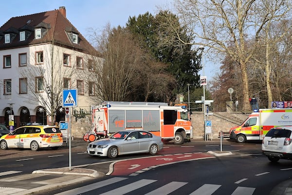 Rescue vehicles are seen near a crime scene in Aschaffenburg, Germany, Wednesday, Jan 22, 2025, where two people were killed in a knife attack. (Ralf Hettler/dpa via AP)