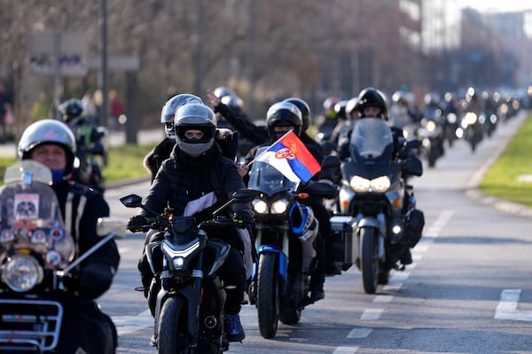 People ride motorcycles during a protest over the collapse of a concrete canopy that killed 15 people more than two months ago, in Novi Sad, Serbia, Saturday, Feb. 1, 2025. (AP Photo/Darko Vojinovic)