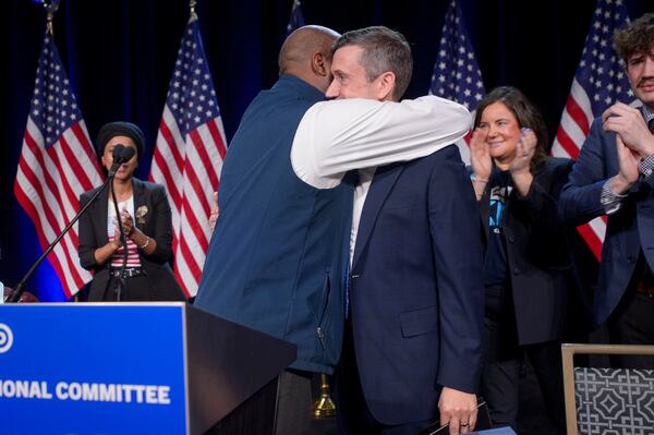 Former Democratic National Committe Chairman Jamie Harrison, left, congratulates newly elected DNC Chairman Ken Martin, right, after Martin won the vote at the Democratic National Committee Winter Meeting at the Gaylord National Resort and Convention Center in National Harbor, Md., Saturday, Feb. 1, 2025. (AP Photo/Rod Lamkey, Jr.)