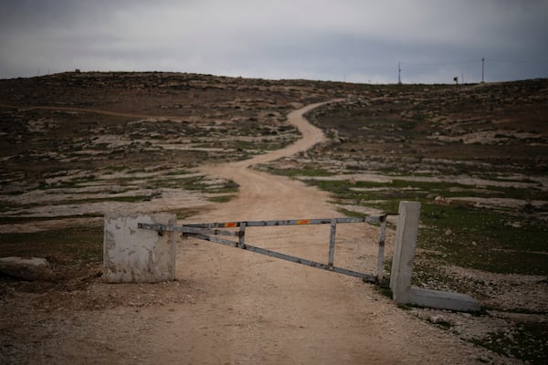 A gate blocks the access for Palestinians, according to local residents, on an area of an Israeli settlers’ outpost near the West Bank village of Tuwani, Monday, March 3, 2025. (AP Photo/Leo Correa)