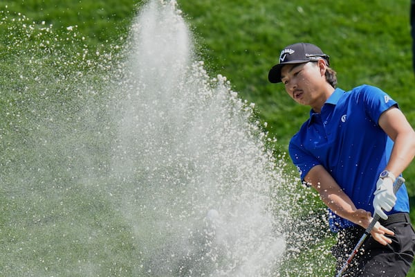 Min Woo Lee leaves his shot in the bunker on the ninth hole during the second round of The Players Championship golf tournament Friday, March 14, 2025, in Ponte Vedra Beach, Fla. (AP Photo/Chris O'Meara)