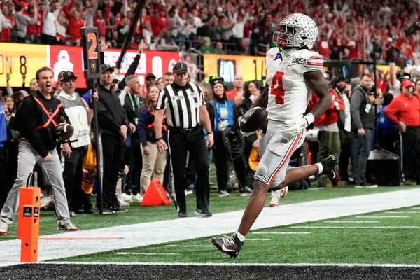 Ohio State wide receiver Jeremiah Smith runs for a touchdown against Notre Dame during first half of the College Football Playoff national championship game Monday, Jan. 20, 2025, in Atlanta. (AP Photo/Brynn Anderson)