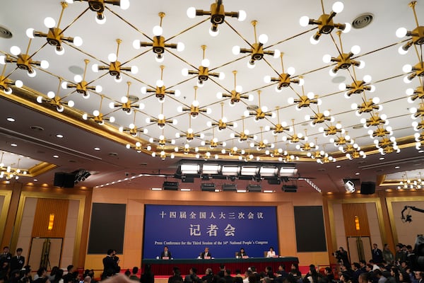 Chinese Foreign Minister Wang Yi attends a press conference on the sideline of the National People's Congress in Beijing, Friday, March 7, 2025. (AP Photo/Ng Han Guan)