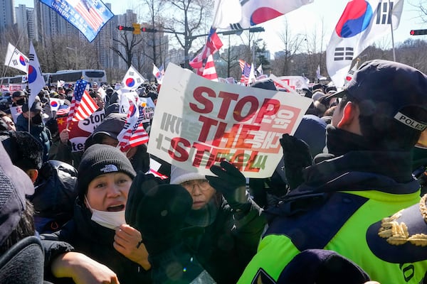 Supporters of impeached South Korean President Yoon Suk Yeol attend a rally to oppose his impeachment near the Corruption Investigation Office for High-Ranking Officials in Gwacheon, South Korea, Wednesday, Jan. 15, 2025. (AP Photo/Ahn Young-joon)