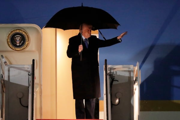 President Donald Trump waves from the stairs of Air Force One upon his arrival at Joint Base Andrews, Md., Monday, March 17, 2025 (AP Photo/Luis M. Alvarez)