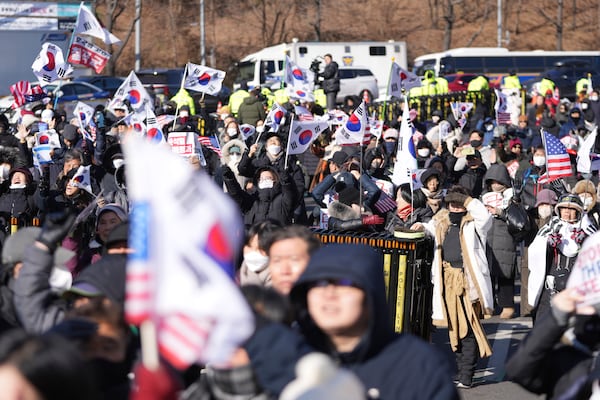 Supporters of impeached South Korean President Yoon Suk Yeol stage a rally to oppose his impeachment near the presidential residence in Seoul, South Korea, Wednesday, Jan. 15, 2025. (AP Photo/Lee Jin-man)