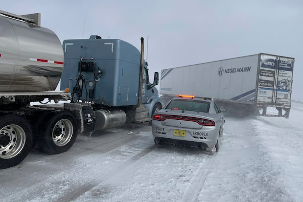 In this photo provided by the Iowa State Patrol, a jackknifed semi truck blocks both eastbound lanes on U.S. 20 east of Fort Dodge, Iowa, on Wednesday, March 5, 2025. (Trooper Paul Gardner/Iowa State Patrol via AP)