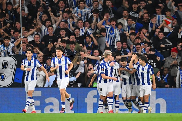 Real Sociedad players celebrate after Real Sociedad's Mikel Oyarzabal scored his side's opening goal during the Europa League round of 16 first leg soccer match between Real Sociedad and Manchester United at the Reale Arena in San Sebastian, Spain, Thursday, March 6, 2025. (AP Photo/Miguel Oses)