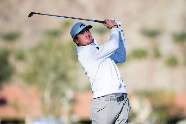 Nick Dunlap hits toward the first fairway at La Quinta Country Club Course during the first round of the American Express golf tournament in La Quinta, Calif., Thursday, Jan. 16, 2025. (AP Photo/William Liang)