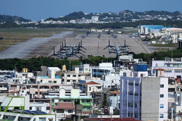 U.S. MV-22 Osprey transport aircraft are parked at the U.S. Marine Corps Air Station Futenma in Ginowan, on the main island of the Okinawa archipelago, southern Japan, Tuesday, Feb. 18, 2025. (AP Photo/Hiro Komae)