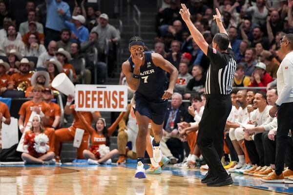 Xavier guard Ryan Conwell (7) reacts after scoring during the first half of a First Four college basketball game against Texas in the NCAA Tournament, Wednesday, March 19, 2025, in Dayton, Ohio. (AP Photo/Jeff Dean)