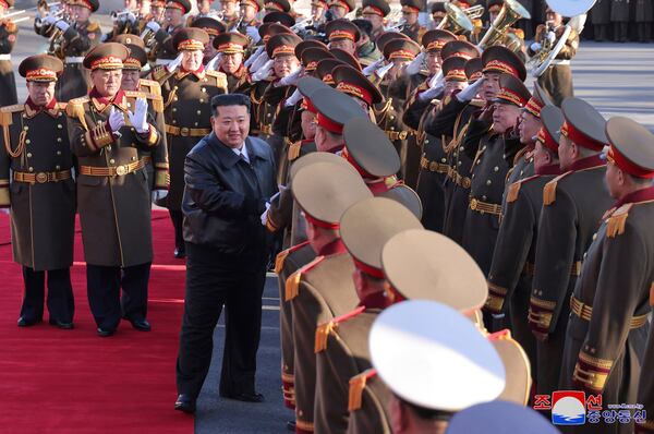 This photo provided Monday, Feb. 10, 2025, by the North Korean government, North Korean leader Kim Jong Un, center, is greeted by military officials at the defense ministry in Pyongyang, Saturday, Feb. 8, 2025. Independent journalists were not given access to cover the event depicted in this image distributed by the North Korean government. The content of this image is as provided and cannot be independently verified. Korean language watermark on image as provided by source reads: "KCNA" which is the abbreviation for Korean Central News Agency. (Korean Central News Agency/Korea News Service via AP)