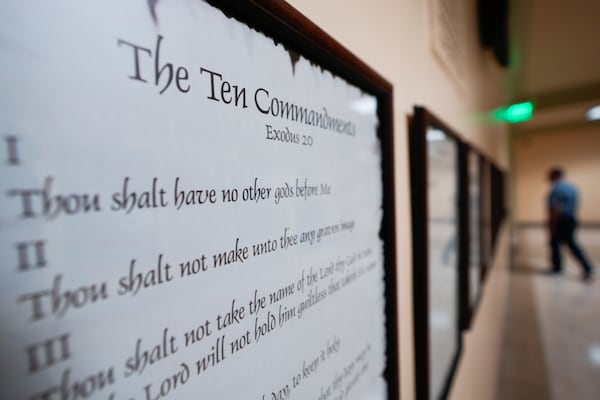 FILE - A copy of the Ten Commandments is posted along with other historical documents in a hallway of the Georgia Capitol, Thursday, June 20, 2024, in Atlanta. (AP Photo/John Bazemore, File)