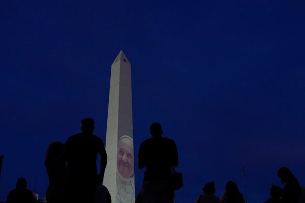 A photo of Pope Francis is projected onto the Obelisk in Buenos Aires, Argentina, Sunday, Feb. 23, 2025. (AP Photo/Natacha Pisarenko)