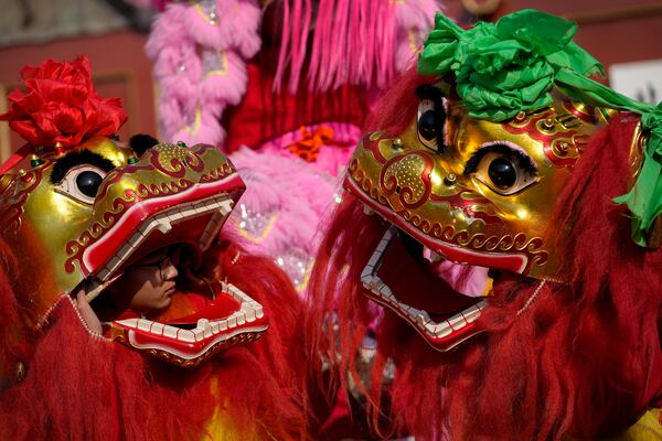 Chinese artists perform a lion dance at the Dongyue Temple on the first day of the Chinese Lunar New Year in Beijing on Wednesday, Jan. 29, 2025. (AP Photo/Andy Wong)