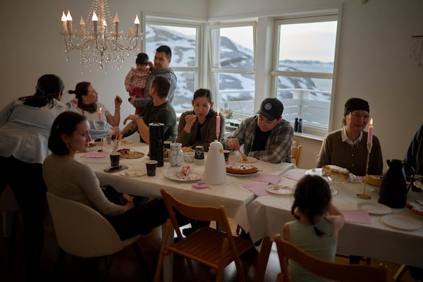 Relatives of Salik Shmidt and Malu Schmidt gather to celebrate their wedding at their house in Nuuk, Greenland, Saturday, Feb. 15, 2025. (AP Photo/Emilio Morenatti)