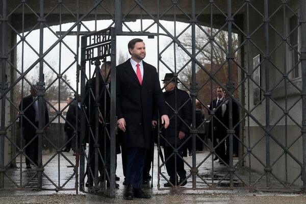 U.S. Vice President JD Vance enters the Dachau Concentration Camp Memorial Site outside Munich, Germany, Thursday, Feb. 13, 2025. (AP Photo/Matthias Schrader)