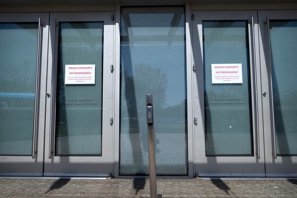 No trespassing signs are posted on doors at the headquarters of the United States Institute of Peace, Tuesday, March 18, 2025, in Washington. (AP Photo/Mark Schiefelbein).