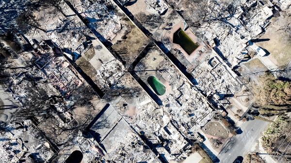 Residences destroyed by the Eaton Fire line a neighborhood in Altadena, Calif., on Tuesday, Jan. 21, 2025. (AP Photo/Noah Berger)