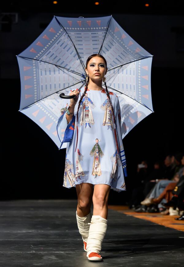 A model wears a design by Lauren Good Day on the runway at the 2025 Native Fashion Show, Friday, May 9, 2025, in Santa Fe, N.M. (AP Photo/Roberto E. Rosales)
