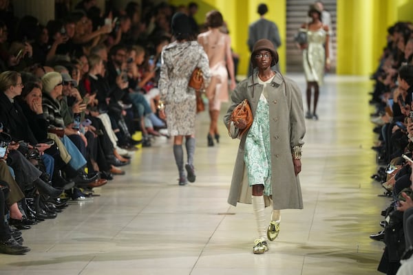 A model wears a creation as part of the Miu Miu Fall/Winter 2025-2026 Womenswear collection presented Tuesday, March 11, 2025. in Paris. (Photo by Scott A Garfitt/Invision/AP)