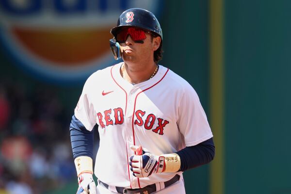 Boston Red Sox's Triston Casas heads to the dugout after flying out to left field during the fourth inning of a baseball game against the Seattle Mariners, Thursday, April 24, 2025, in Boston. (AP Photo/Mark Stockwell)