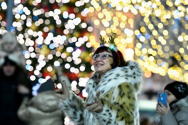 People gather in the center of the Russian far east port of Vladivostok, Russia, Tuesday, Dec. 31, 2024, to celebrate the new year. (AP Photo)