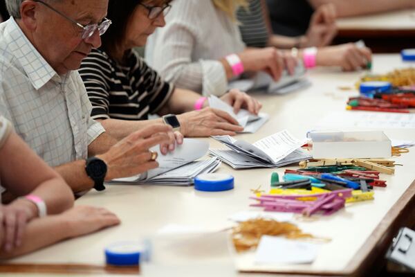 Votes are counted at Grimsby Town Hall, in Lincolnshire, for the Greater Lincolnshire Mayor election, Thursday, May 1, 2025. (Joe Giddens/PA via AP)