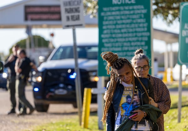 Florence, front center, the younger sister of Jessie Hoffman Jr., is consoled by a supporter as she walks away from the entrance to the Louisiana State Penitentiary in Angola, La., upon hearing that her brother was executed Tuesday, March 18, 2025. (Chris Granger/The Times-Picayune/The New Orleans Advocate via AP)